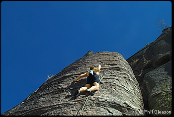 Climber on Omak Rock. Photo by Phil Gleason