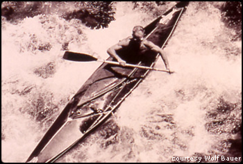 Wolf Bauer kayaking in white water