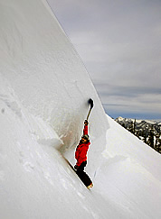 Bram Thrift examines the crown wall of a slab avalanche at Alpental on January 1, 2008.  The avalanche occurred the previous day.  Photo © David Kratsch.