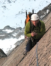 John Plotz warming his hands on the Fin Traverse, Backbone Ridge.  Photo © Ade Miller.