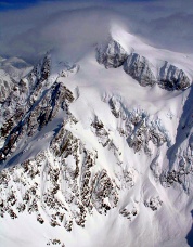 Mount Shuksan’s West Face, showing the parallel slanting gullies.  Photo © John Scurlock.