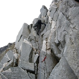 Rolf Larson climbing the first pitch of Tillie’s Tower, North Arte. Photo © Eric Wehrly.