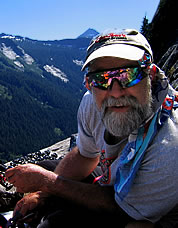 David Whitelaw sorting gear in the heat at the Balcony Bivy. Photo © Bill Enger.