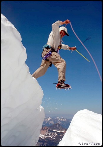 Donn Venema jumps a Challenger Glacier crevasse.  Photo © Steph Abegg.