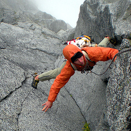Blake Herrington climbs a steep corner on “Gorillas in the Mist.” Photo © Jens Holsten.