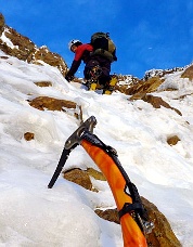 Unroped climbing low on the “Black Spider.” Photo © Beau Carillo.