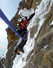 Climbing thin ice over rock on the “Black Spider.” Photo © Beau Carillo.