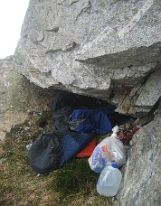 Bivi cave with supplies packed by the park rangers. Photo © Jason Schilling.